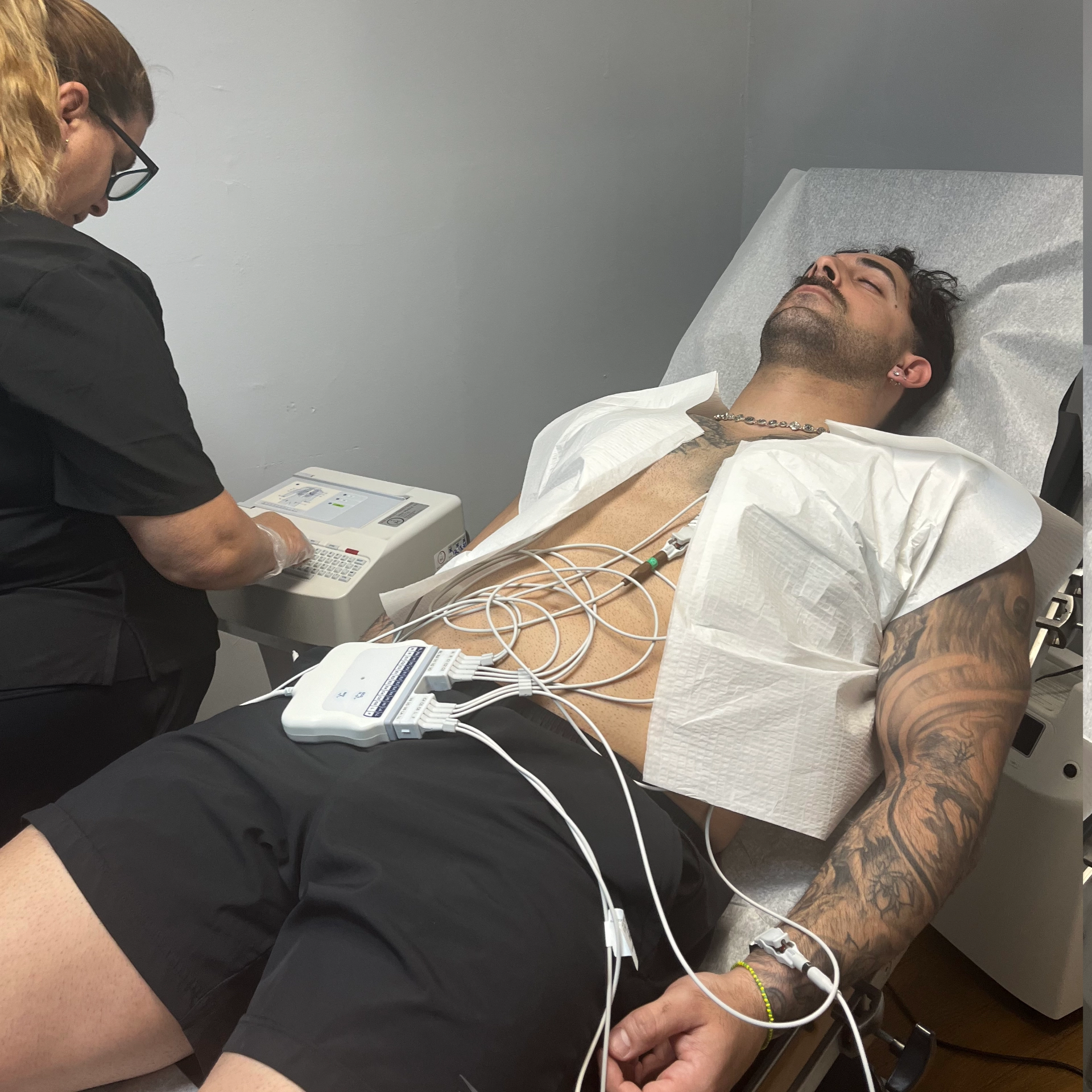 Patient receiving EKG services and heart rhythm evaluation at MediCruz Medical Clinic in Tampa, Florida.